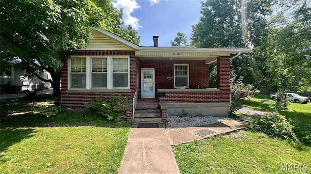 315 E College Ave, Fredericktown, MO 63645 - bungalow-style home featuring brick siding, a front lawn, and a porch