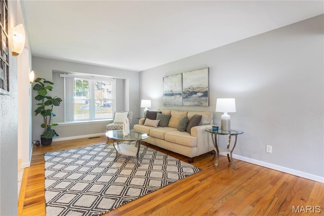 894 Napoli Dr, Ballwin, MO 63021 - living room featuring wood finished floors and baseboards