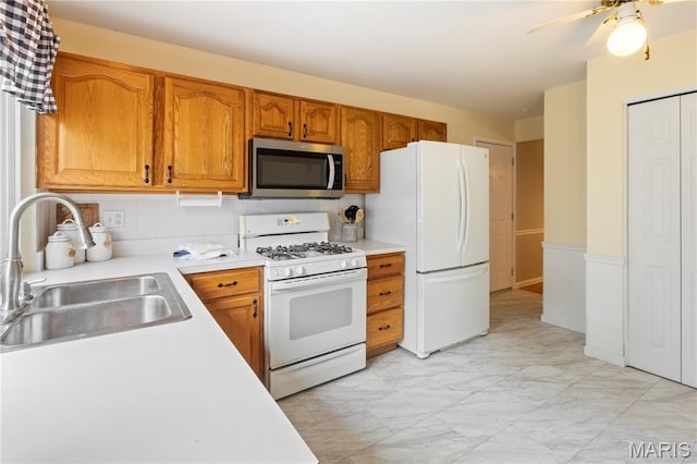 894 Napoli Dr, Ballwin, MO 63021 - kitchen with white appliances, light countertops, light marble finish flooring, backsplash, and brown cabinets