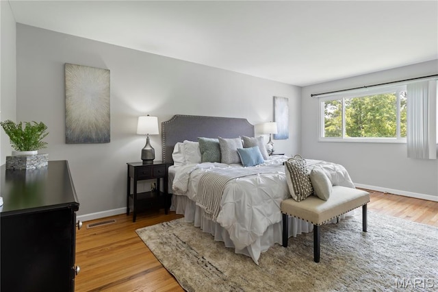 894 Napoli Dr, Ballwin, MO 63021 - bedroom featuring light wood-style flooring and baseboards