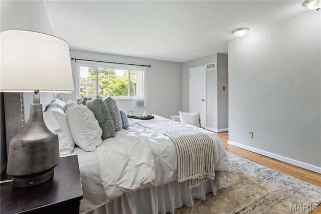 894 Napoli Dr, Ballwin, MO 63021 - bedroom with baseboards and wood finished floors