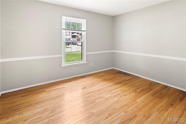 894 Napoli Dr, Ballwin, MO 63021 - spare room with light wood-type flooring and baseboards