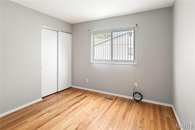 894 Napoli Dr, Ballwin, MO 63021 - unfurnished bedroom featuring hardwood / wood-style floors and a closet