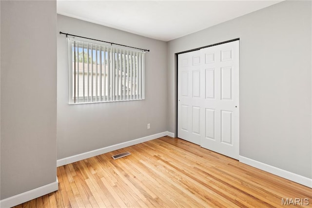 894 Napoli Dr, Ballwin, MO 63021 - unfurnished bedroom featuring light wood-type flooring and a closet