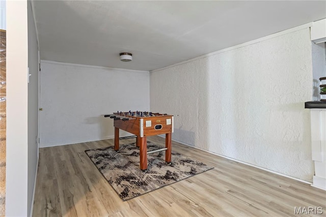 894 Napoli Dr, Ballwin, MO 63021 - rec room with a textured wall and wood finished floors