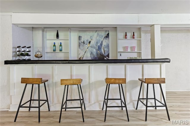 894 Napoli Dr, Ballwin, MO 63021 - indoor dry bar with a textured wall and light wood finished floors