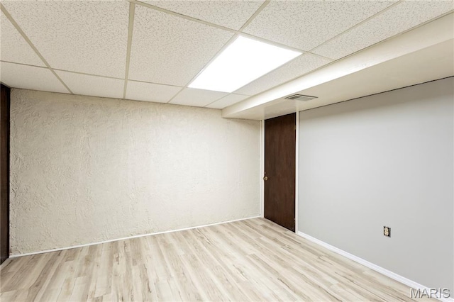 894 Napoli Dr, Ballwin, MO 63021 - finished below grade area with a paneled ceiling and wood finished floors