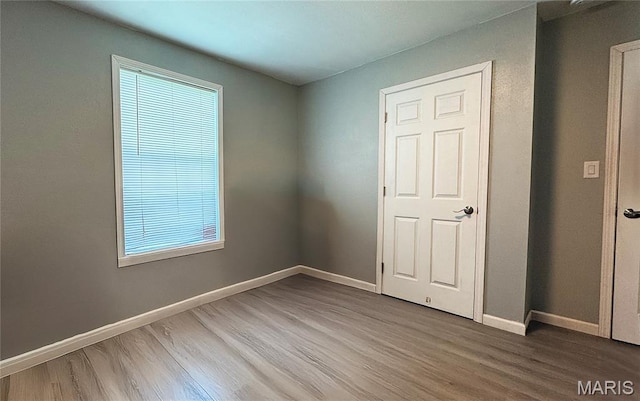 110 5th St, Park Hills, MO 63601 - unfurnished bedroom with wood finished floors and baseboards