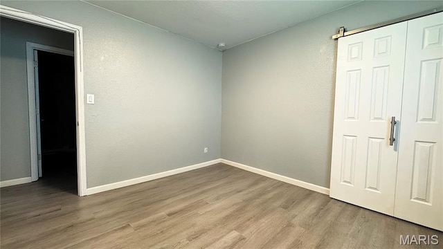 110 5th St, Park Hills, MO 63601 - empty room with wood finished floors and baseboards