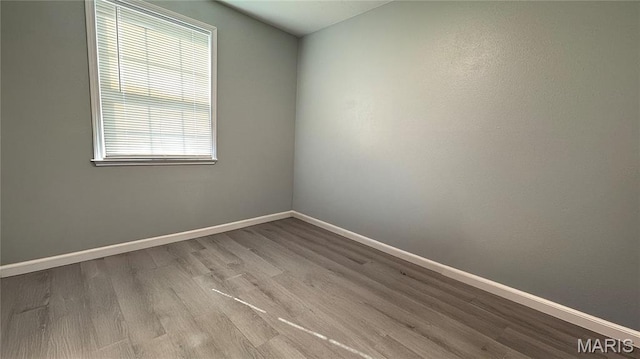 110 5th St, Park Hills, MO 63601 - unfurnished room with plenty of natural light, baseboards, and wood finished floors
