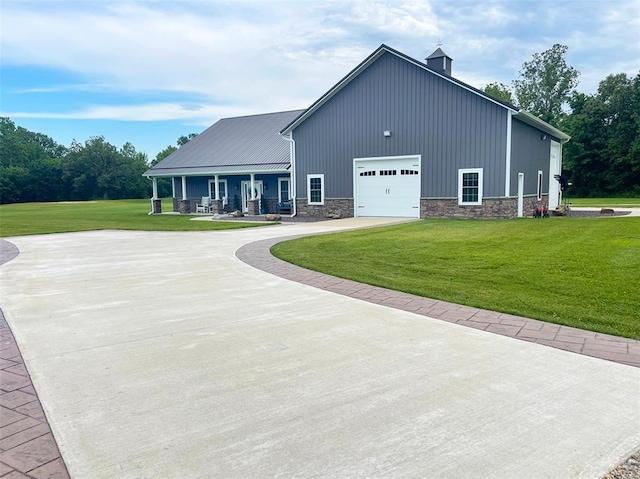 18428 Lake Circle Dr, Dexter, MO 63841 - view of front of property with stone siding, driveway, board and batten siding, a front yard, and a porch