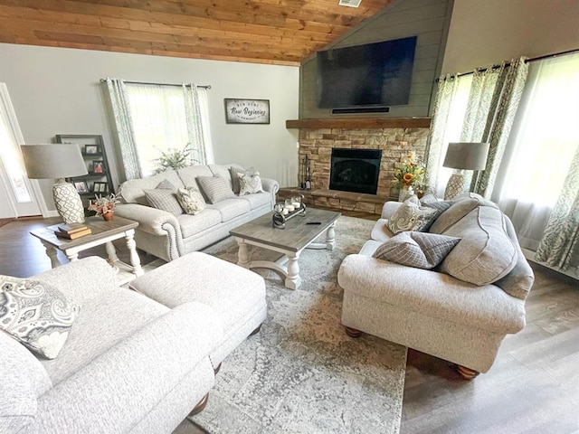 18428 Lake Circle Dr, Dexter, MO 63841 - living room with wood ceiling, wood finished floors, lofted ceiling, and a stone fireplace