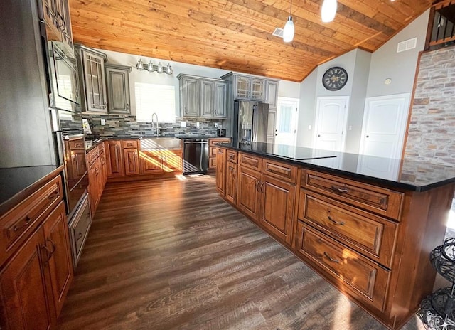 18428 Lake Circle Dr, Dexter, MO 63841 - kitchen with dark countertops, stainless steel appliances, dark wood finished floors, wooden ceiling, and backsplash