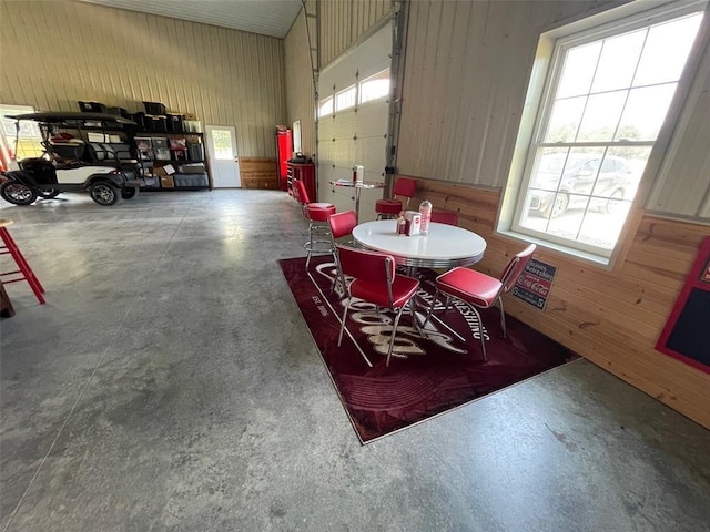 18428 Lake Circle Dr, Dexter, MO 63841 - dining space with finished concrete floors and wooden walls