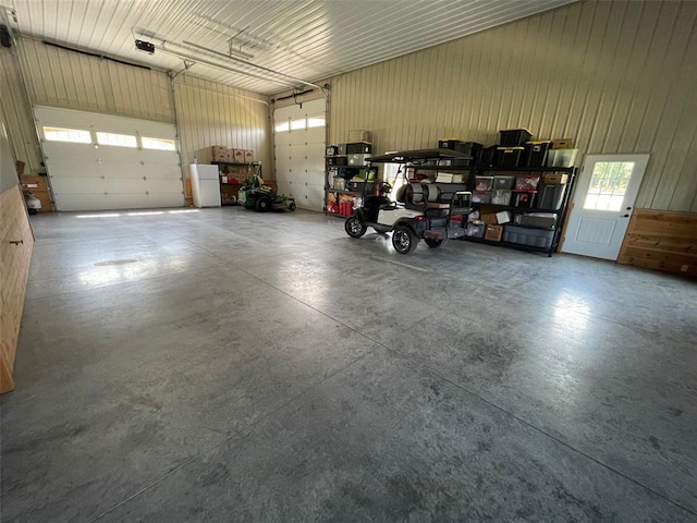 18428 Lake Circle Dr, Dexter, MO 63841 - garage featuring a garage door opener