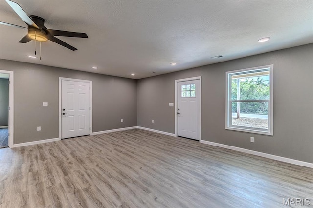 1223 Utah St, Lebanon, MO 65536 - unfurnished living room with light wood-style flooring, a ceiling fan, baseboards, and recessed lighting