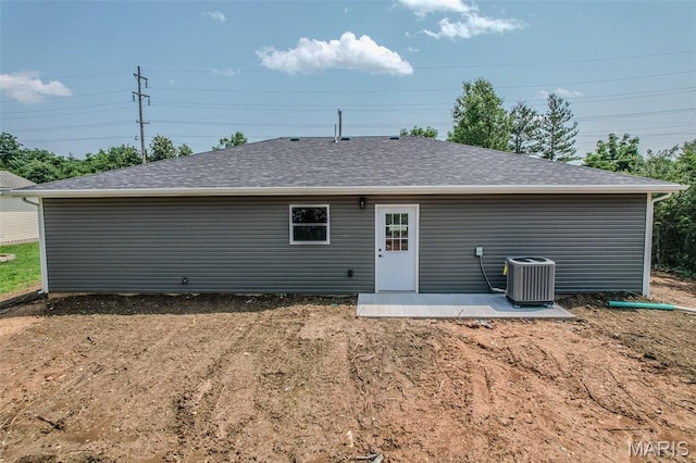 1223 Utah St, Lebanon, MO 65536 - back of house with central AC unit, a patio area, and a shingled roof