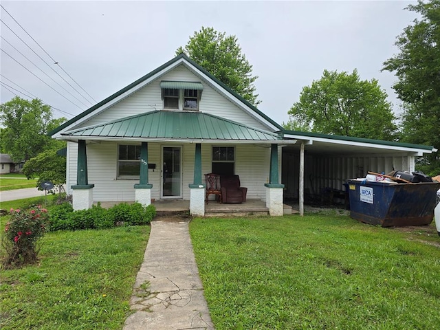533 W Hawthorne St, Houston, MO 65483 - view of front of property featuring a porch, a front lawn, metal roof, and an attached carport