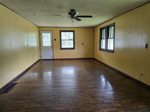 533 W Hawthorne St, Houston, MO 65483 - empty room with wood finished floors, healthy amount of natural light, and wooden walls