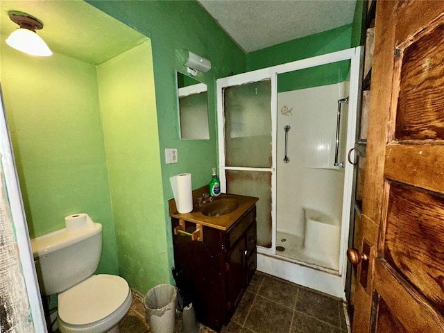 533 W Hawthorne St, Houston, MO 65483 - bathroom featuring vanity, a shower stall, toilet, tile patterned flooring, and a textured ceiling