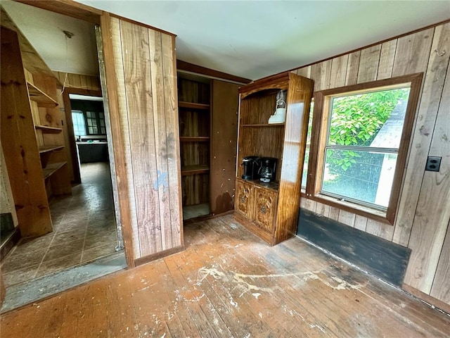 533 W Hawthorne St, Houston, MO 65483 - unfurnished living room featuring wood walls and hardwood / wood-style flooring