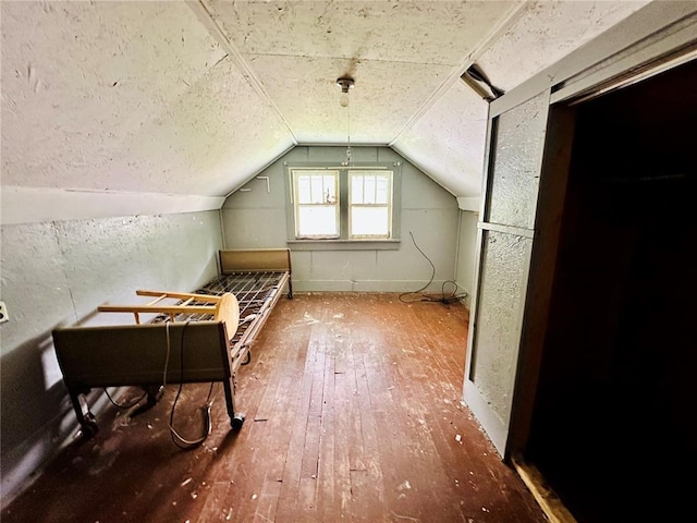 533 W Hawthorne St, Houston, MO 65483 - additional living space with hardwood / wood-style flooring and vaulted ceiling