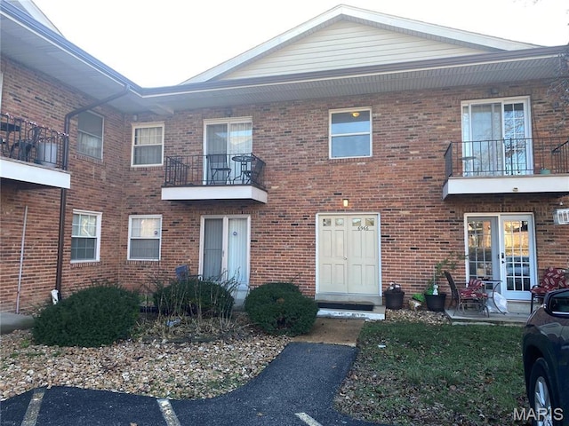 6966 Colonial Woods Dr Unit 62, Saint Louis, MO 63129 - multi unit property featuring a balcony and brick siding