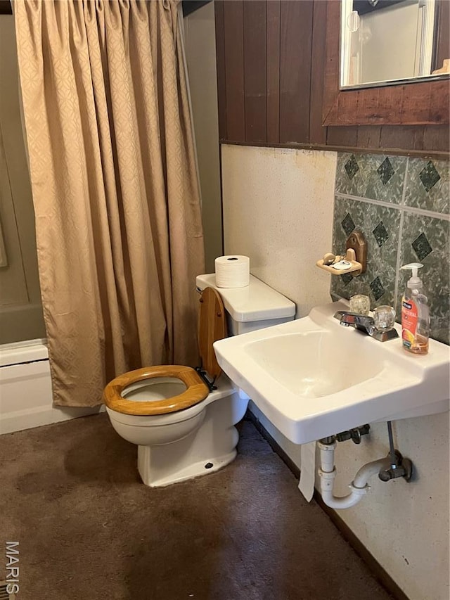 711 Lester St, Kennett, MO 63857 - full bathroom with shower / bathtub combination with curtain and backsplash
