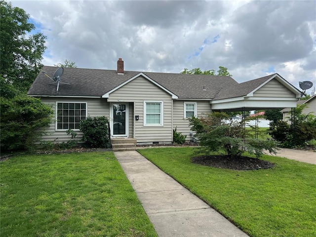 1904 E Parkview, Caruthersville, MO 63830 - ranch-style house featuring a shingled roof, a front yard, and a chimney