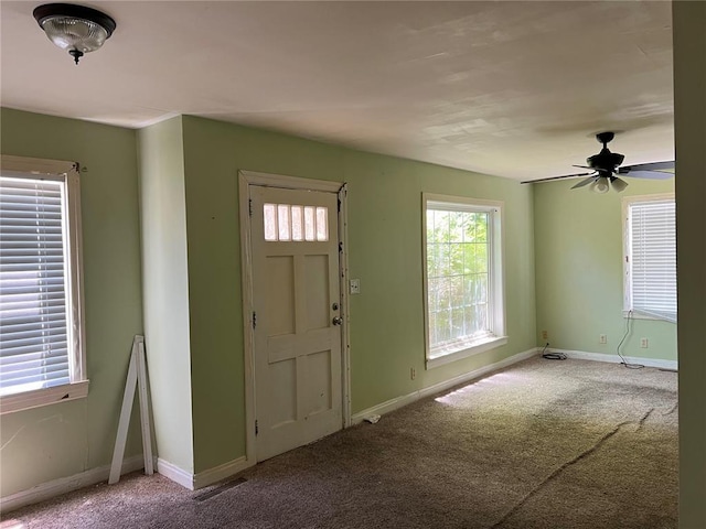 1904 E Parkview, Caruthersville, MO 63830 - entryway featuring carpet, baseboards, and ceiling fan