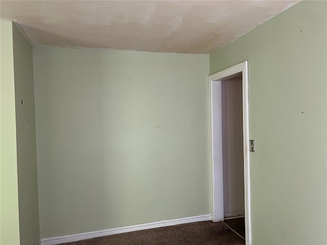 1904 E Parkview, Caruthersville, MO 63830 - unfurnished room featuring dark carpet and baseboards