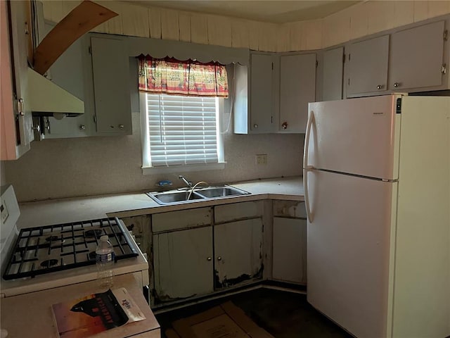 1904 E Parkview, Caruthersville, MO 63830 - kitchen with white appliances, a sink, and light countertops