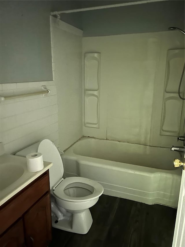 1904 E Parkview, Caruthersville, MO 63830 - bathroom with toilet, wood finished floors, vanity, and shower / tub combination