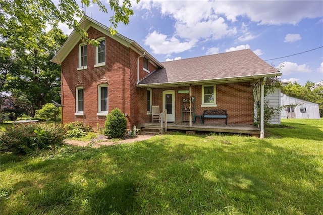 216 County Road 512, Shawneetown, MO 63732 - view of front of property featuring brick siding, a front yard, and roof with shingles