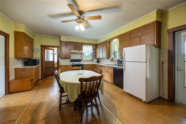 216 County Road 512, Shawneetown, MO 63732 - kitchen featuring black appliances, ornamental molding, a sink, brown cabinetry, and a ceiling fan