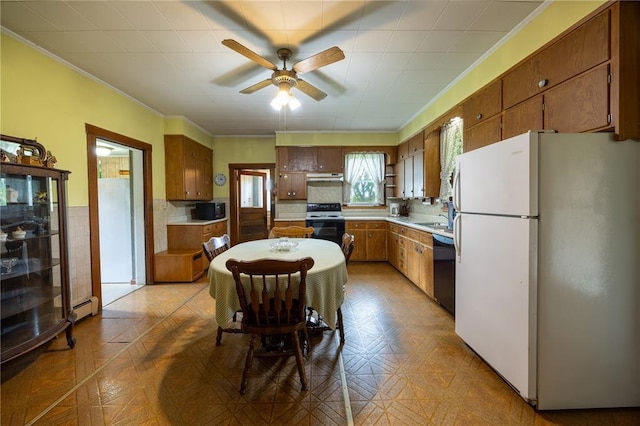 216 County Road 512, Shawneetown, MO 63732 - kitchen featuring white appliances, a ceiling fan, under cabinet range hood, brown cabinets, and crown molding