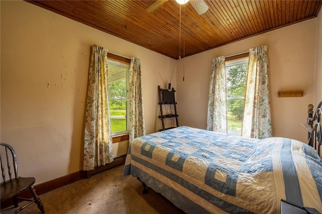 216 County Road 512, Shawneetown, MO 63732 - bedroom with wooden ceiling, carpet, a ceiling fan, baseboards, and a baseboard radiator