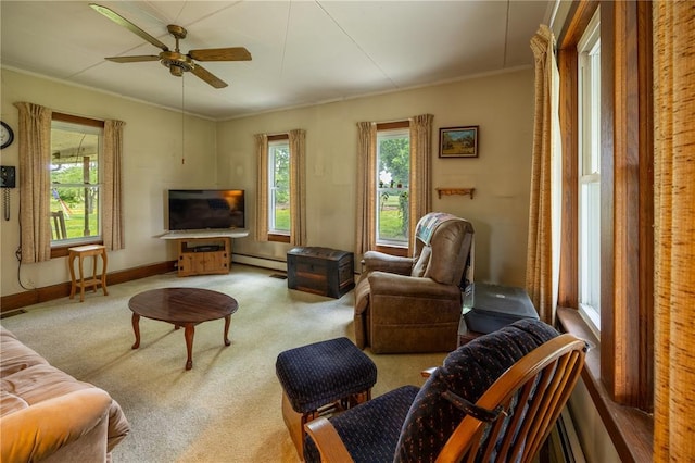 216 County Road 512, Shawneetown, MO 63732 - carpeted living room with a baseboard radiator, crown molding, a ceiling fan, and baseboards