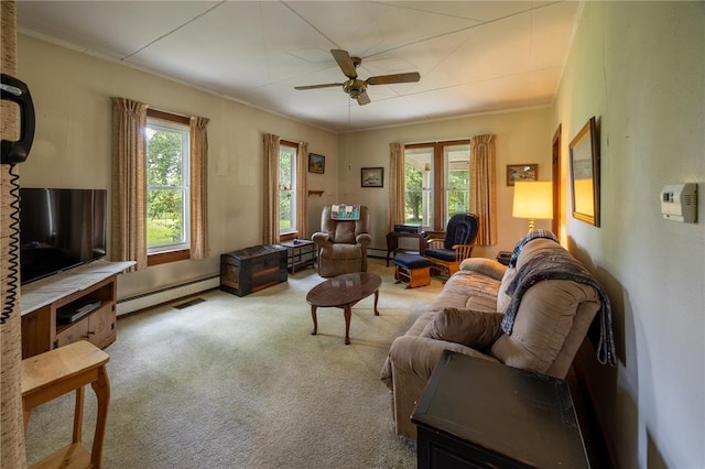 216 County Road 512, Shawneetown, MO 63732 - carpeted living room featuring a baseboard heating unit, plenty of natural light, ceiling fan, and crown molding