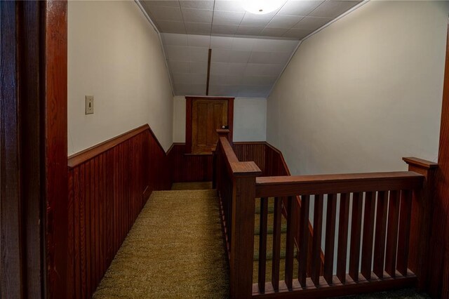216 County Road 512, Shawneetown, MO 63732 - hallway featuring an upstairs landing, wainscoting, wood walls, and vaulted ceiling