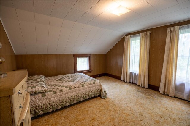 216 County Road 512, Shawneetown, MO 63732 - carpeted bedroom featuring multiple windows, wooden walls, lofted ceiling, and baseboards