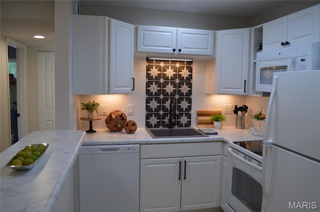 115 Lemans Ct Unit 115, Lake St Louis, MO 63367 - kitchen featuring white appliances, light countertops, white cabinetry, a sink, and recessed lighting