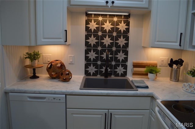 115 Lemans Ct Unit 115, Lake St Louis, MO 63367 - kitchen with white dishwasher, light countertops, a sink, and white cabinetry
