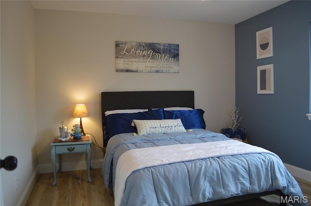 115 Lemans Ct Unit 115, Lake St Louis, MO 63367 - bedroom with wood finished floors and baseboards