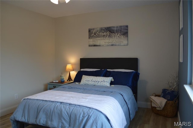 115 Lemans Ct Unit 115, Lake St Louis, MO 63367 - bedroom with wood finished floors and baseboards