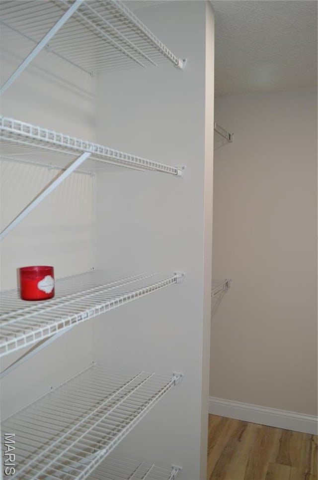 115 Lemans Ct Unit 115, Lake St Louis, MO 63367 - walk in closet featuring wood finished floors