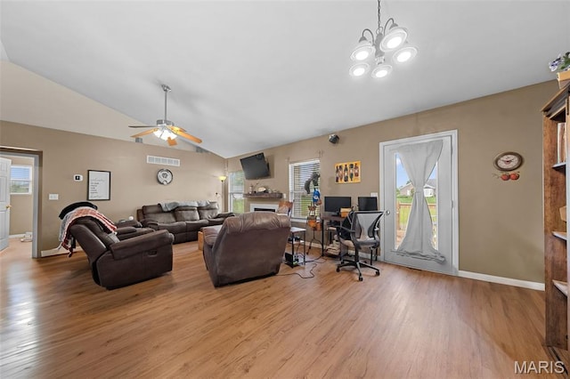 81 Berretta Ct, Wright City, MO 63390 - living area featuring wood finished floors, lofted ceiling, ceiling fan, a fireplace, and healthy amount of natural light
