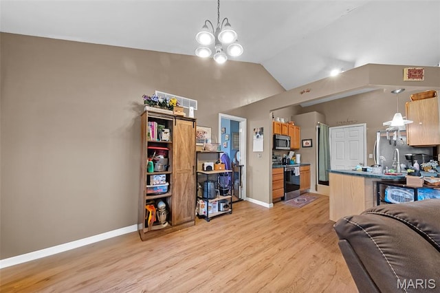 81 Berretta Ct, Wright City, MO 63390 - living area with light wood-style floors, baseboards, vaulted ceiling, and a chandelier