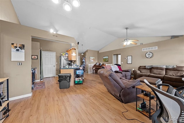 81 Berretta Ct, Wright City, MO 63390 - living area with lofted ceiling, light wood-style floors, ceiling fan, and baseboards