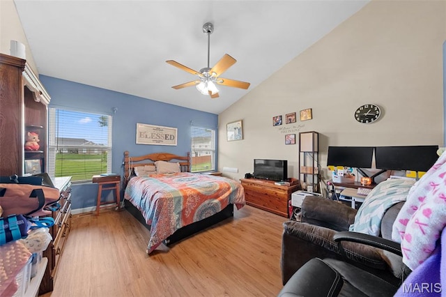81 Berretta Ct, Wright City, MO 63390 - bedroom featuring light wood-style flooring, multiple windows, high vaulted ceiling, and a ceiling fan